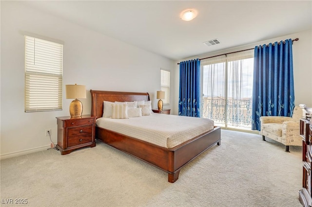 bedroom with light colored carpet