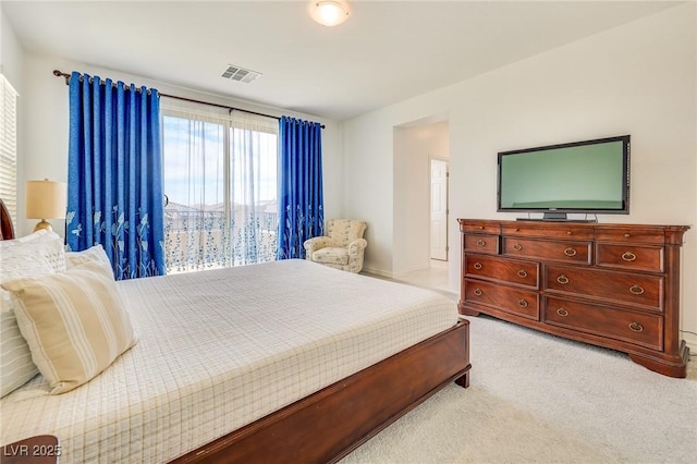 bedroom with light colored carpet