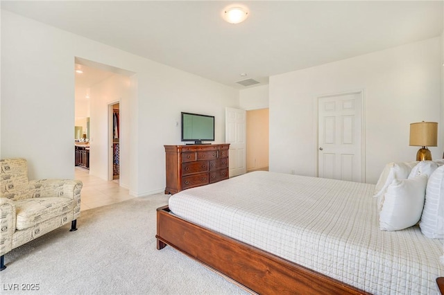 bedroom with light colored carpet