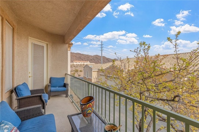 balcony featuring a mountain view