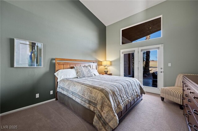 bedroom with light carpet, access to outside, and high vaulted ceiling