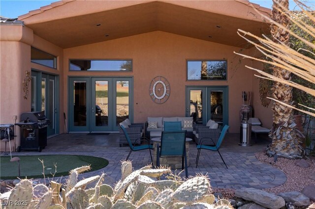 view of patio featuring french doors, grilling area, and an outdoor hangout area