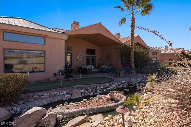 back of house featuring a patio area