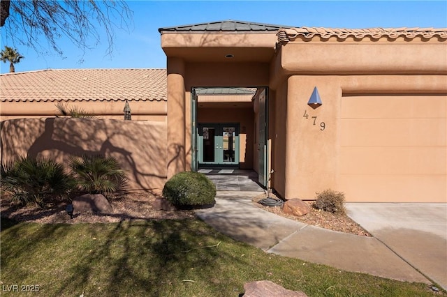 view of exterior entry featuring a garage