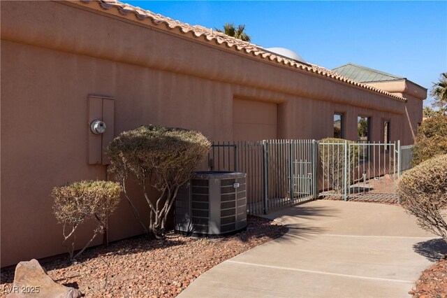 view of property exterior with cooling unit