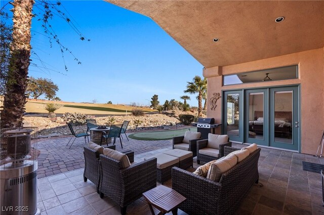 view of patio / terrace with grilling area and an outdoor hangout area