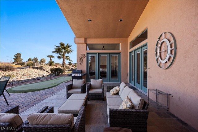 view of patio / terrace with an outdoor living space and grilling area