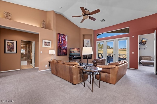 carpeted living room featuring french doors, ceiling fan, and high vaulted ceiling