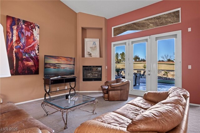 carpeted living room featuring french doors