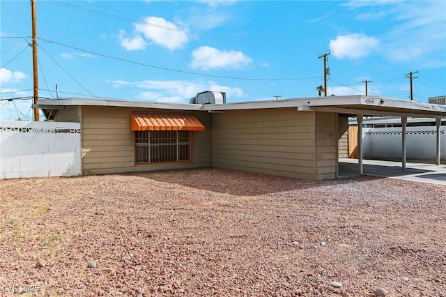 exterior space featuring a carport