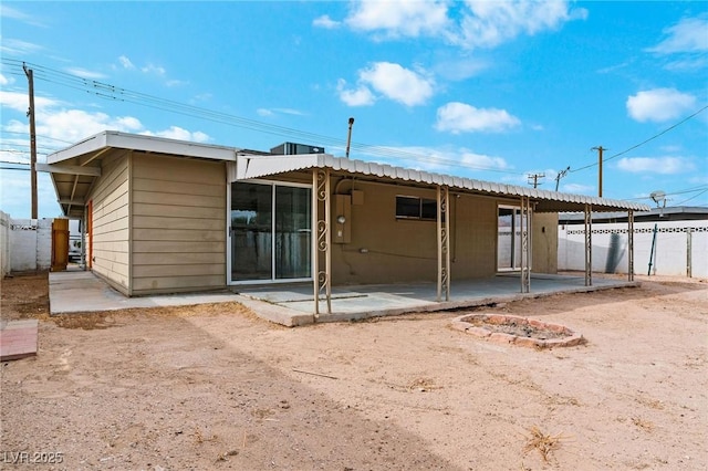 back of house with a patio