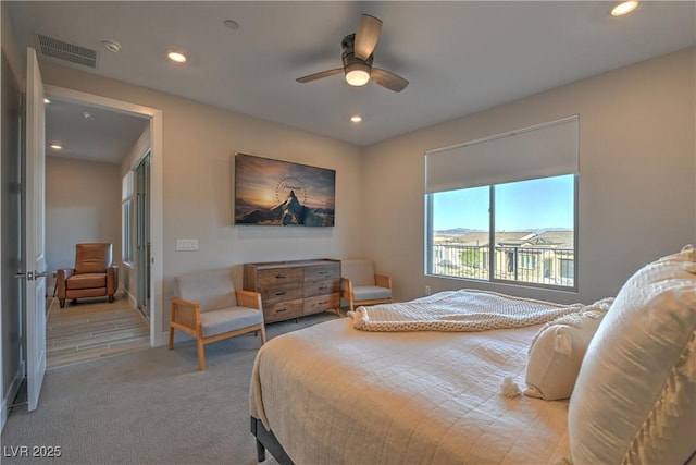 bedroom featuring light carpet and ceiling fan