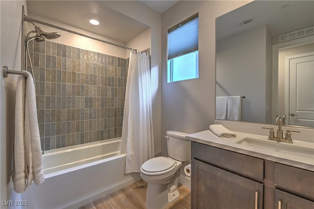 full bathroom featuring vanity, wood-type flooring, toilet, and shower / bath combo with shower curtain