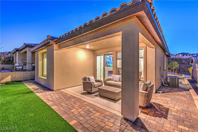 view of patio featuring central AC and an outdoor living space