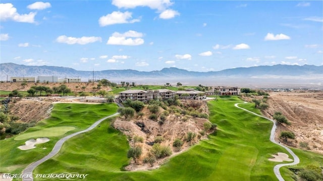 birds eye view of property with a mountain view