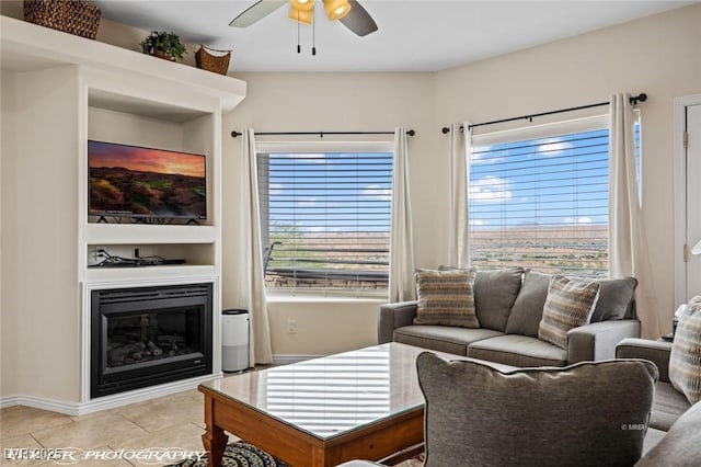 living room with ceiling fan and light tile patterned floors