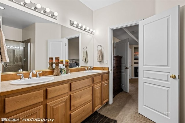 bathroom featuring vanity and a shower with shower door