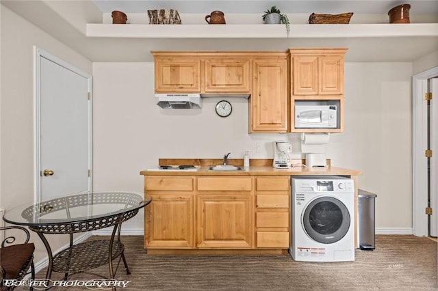 kitchen featuring sink, washer / clothes dryer, white microwave, and light brown cabinets