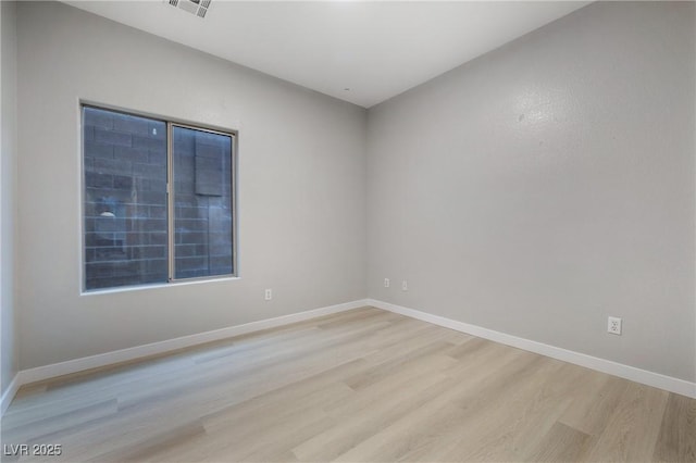 unfurnished room featuring light hardwood / wood-style floors