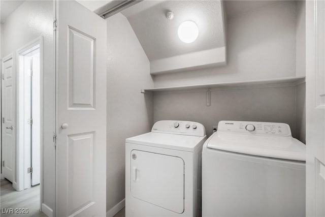 washroom with independent washer and dryer