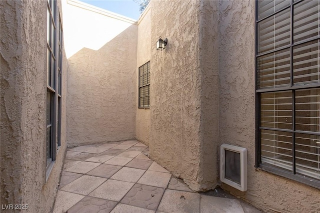 view of property exterior featuring a patio