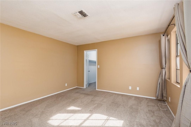 unfurnished room with light colored carpet