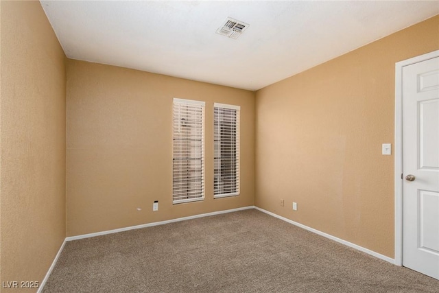 empty room with carpet flooring