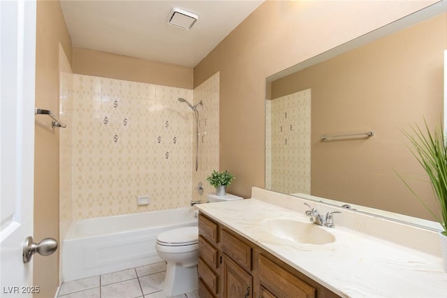 full bathroom with tiled shower / bath combo, vanity, tile patterned floors, and toilet