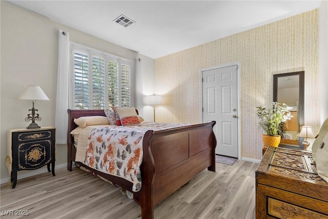 bedroom with light hardwood / wood-style floors