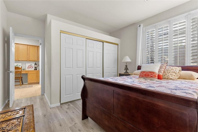 bedroom featuring light hardwood / wood-style floors and a closet