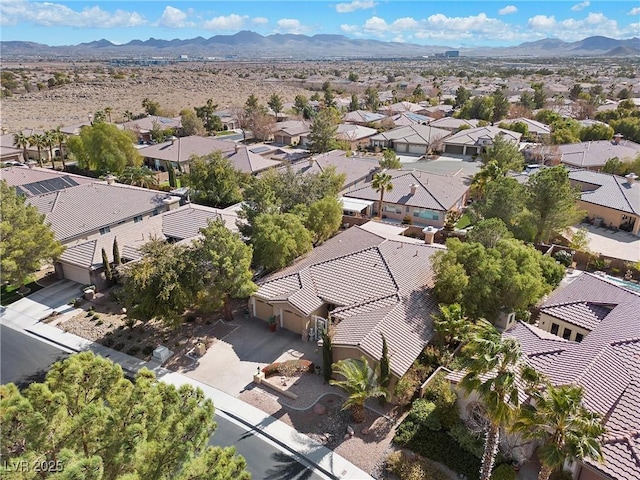 birds eye view of property with a mountain view