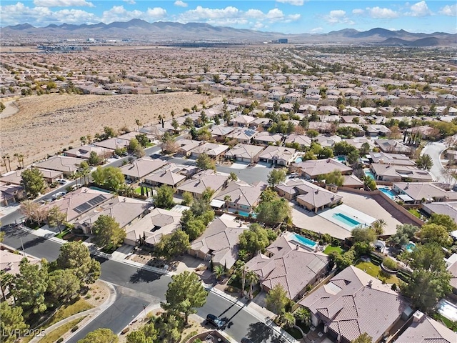 birds eye view of property with a mountain view