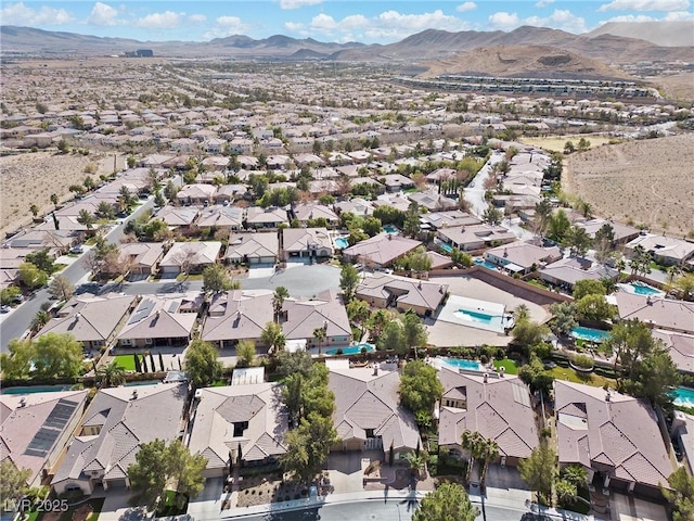 birds eye view of property featuring a mountain view