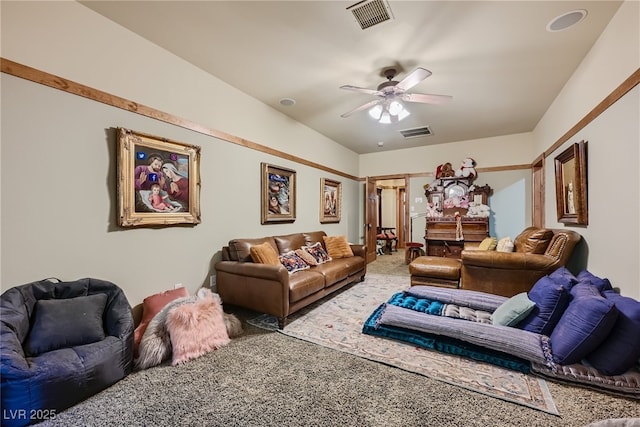 living room with ceiling fan and carpet flooring