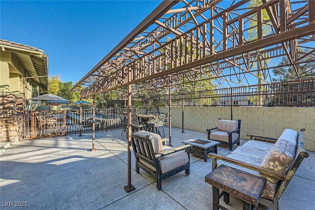 view of patio / terrace featuring a pergola and a fire pit