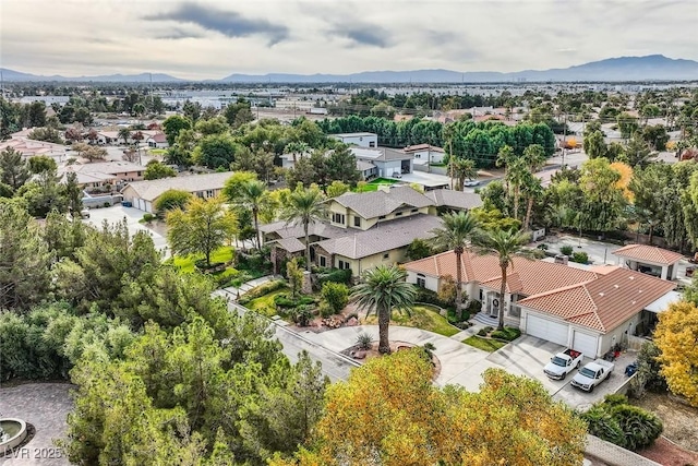 birds eye view of property with a mountain view