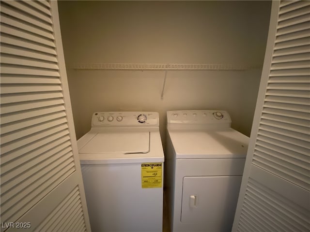 clothes washing area featuring separate washer and dryer