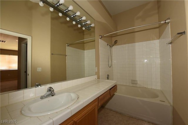 full bathroom with vanity, visible vents, tile patterned flooring, and bathtub / shower combination