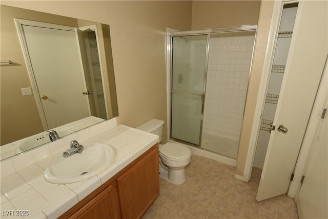full bath with toilet, a shower stall, and vanity
