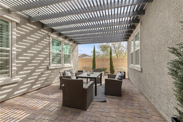 view of patio with a pergola, fence, and an outdoor hangout area