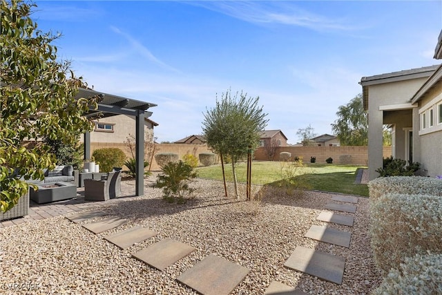 view of yard featuring an outdoor living space with a fire pit, a patio area, and fence