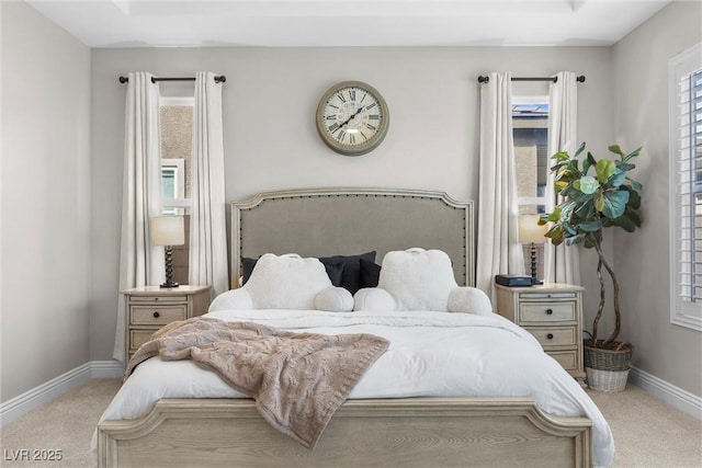 bedroom featuring carpet floors and baseboards