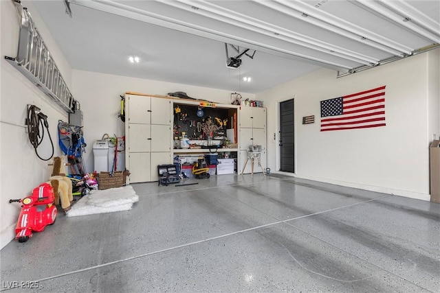 garage featuring a workshop area and a garage door opener