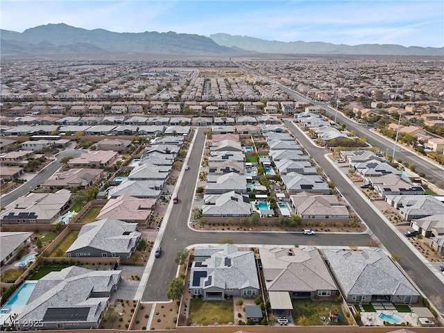 drone / aerial view featuring a residential view and a mountain view