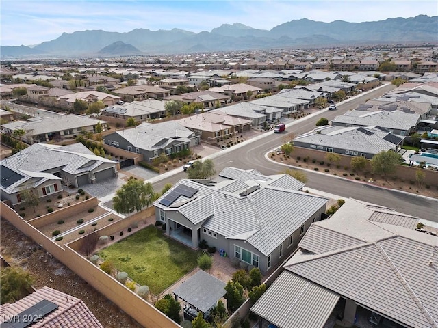 drone / aerial view featuring a residential view and a mountain view