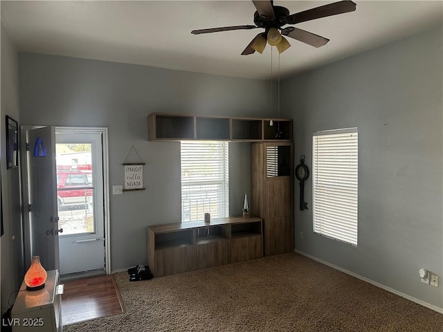 interior space featuring ceiling fan