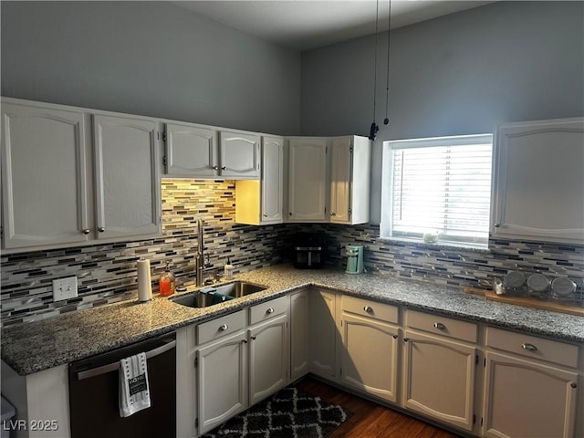 kitchen featuring sink, white cabinetry, dark hardwood / wood-style flooring, dishwasher, and backsplash