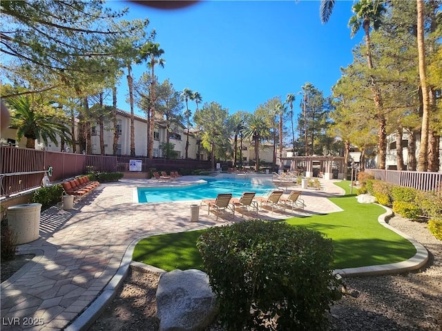 view of swimming pool featuring a patio area