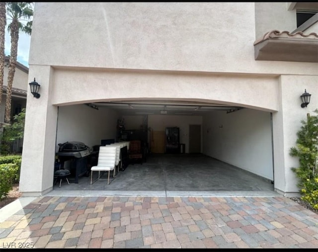 garage featuring driveway
