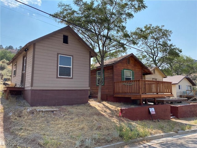 view of front of property with a wooden deck